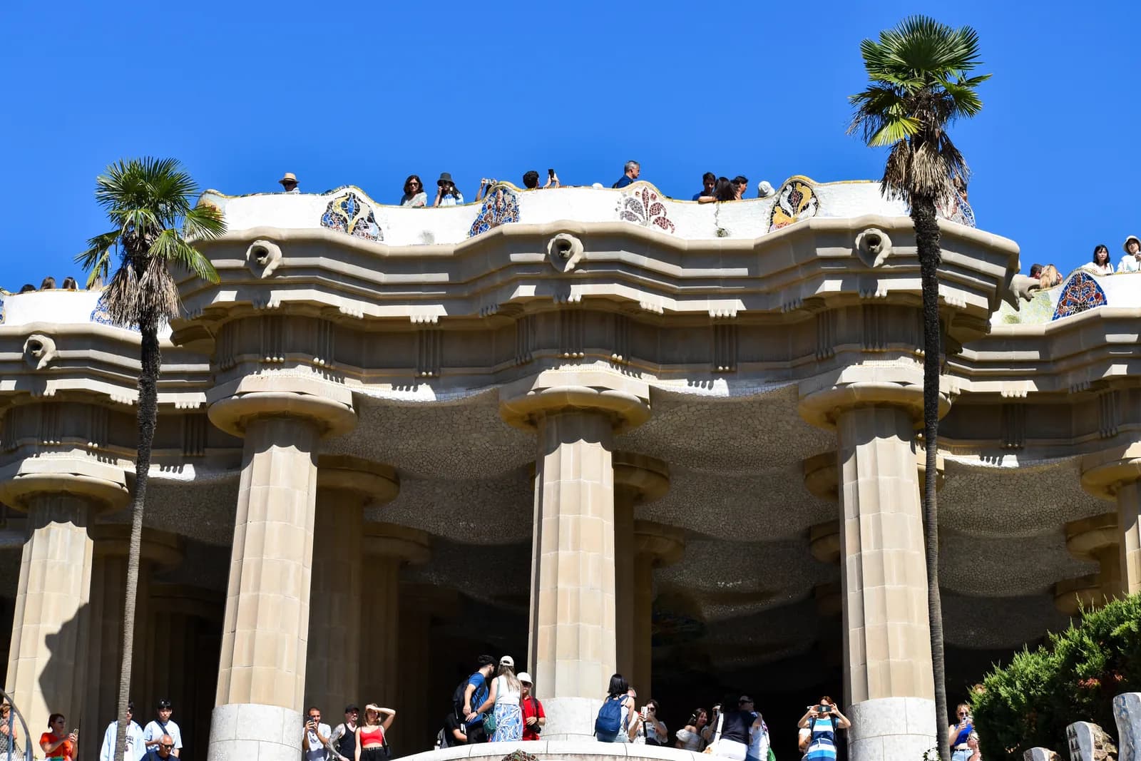 Gaudí's colonnade and serpentine mosaic terrace at Park Güell in Barcelona, Spain