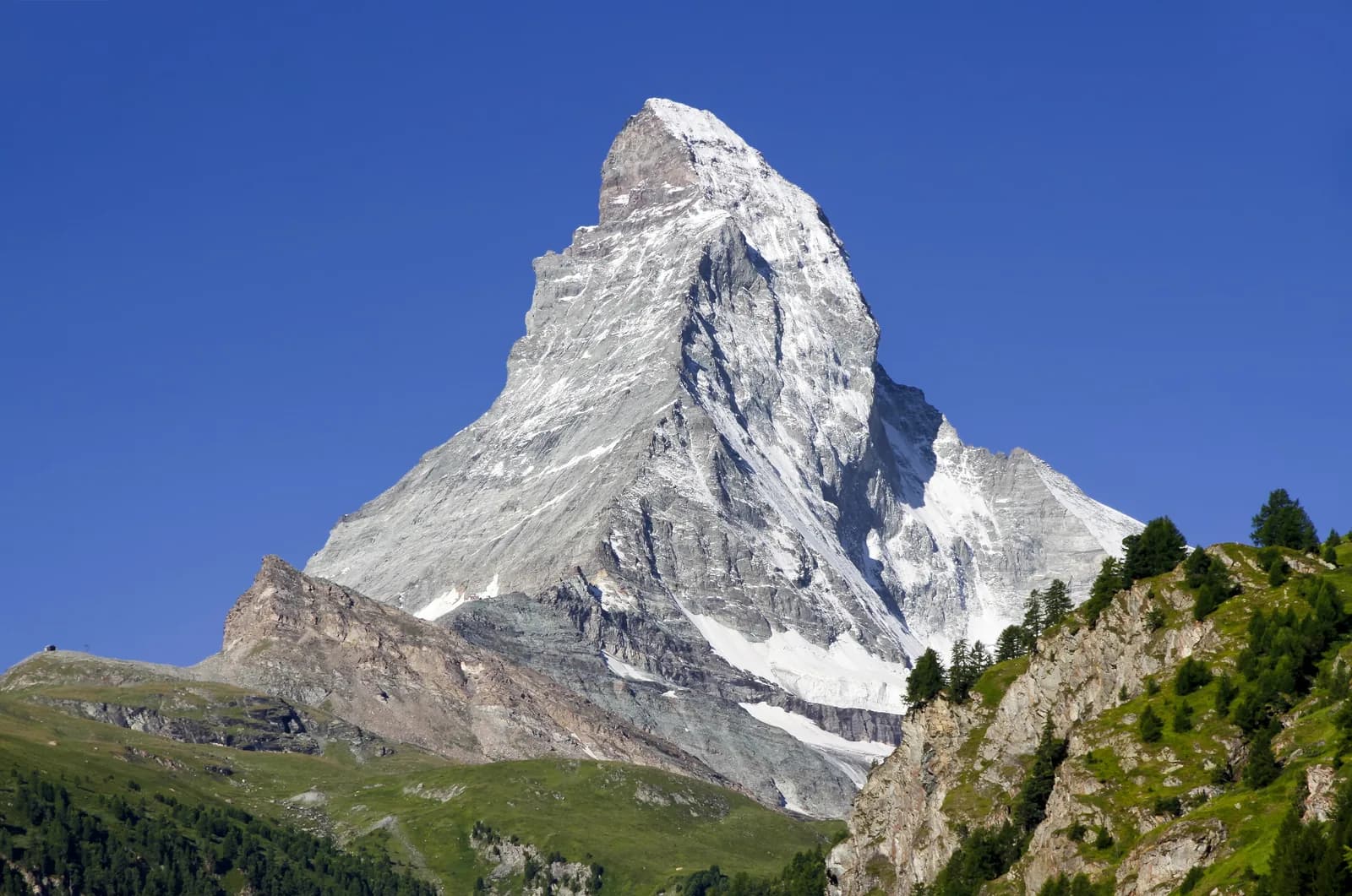 The Matterhorn rising above green slopes near Zermatt, Switzerland