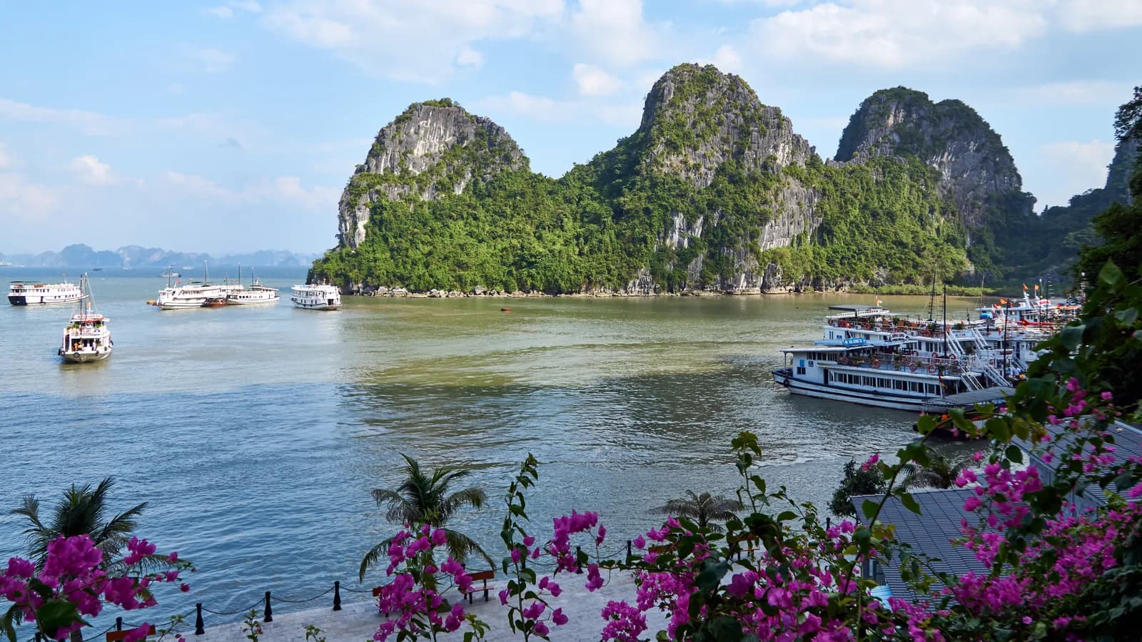 Limestone karst islands and boats in Ha Long Bay, Vietnam