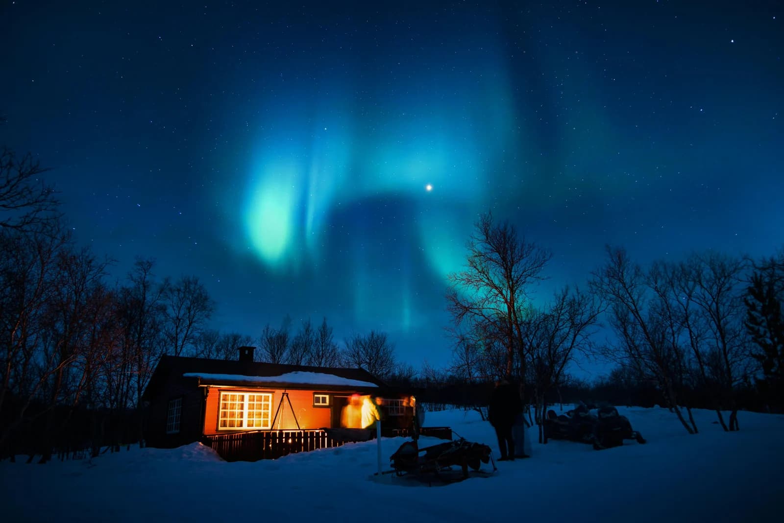 Green aurora over the snow covered hills around Kirkenes in the far north of Norway