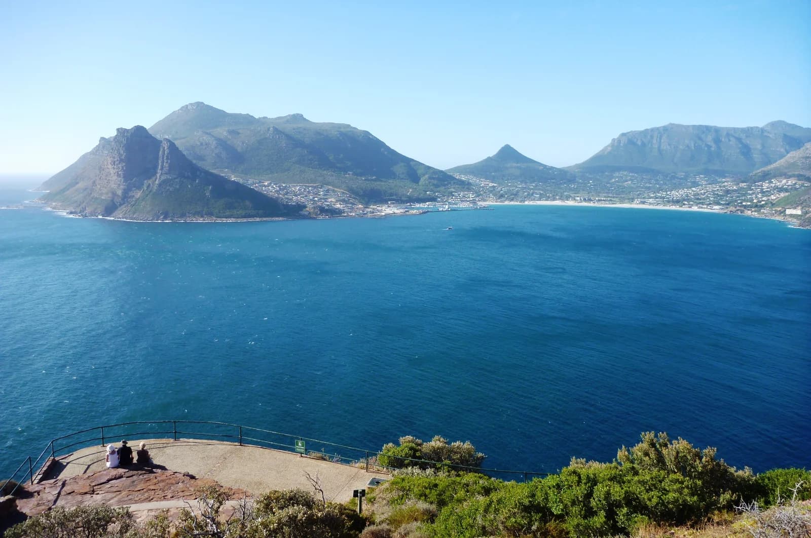 Chapman's Peak Drive cut into the cliff face above the blue water of Hout Bay