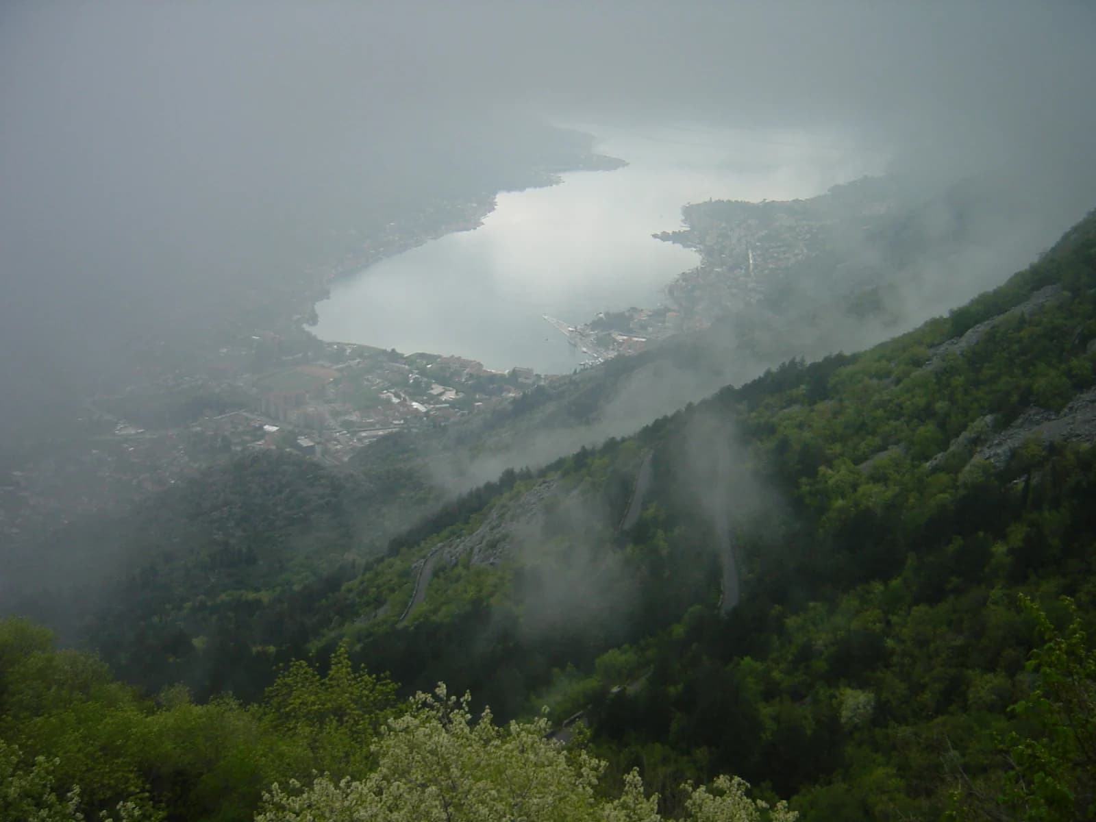 The coastal road winding above the Bay of Kotor with mountains rising behind