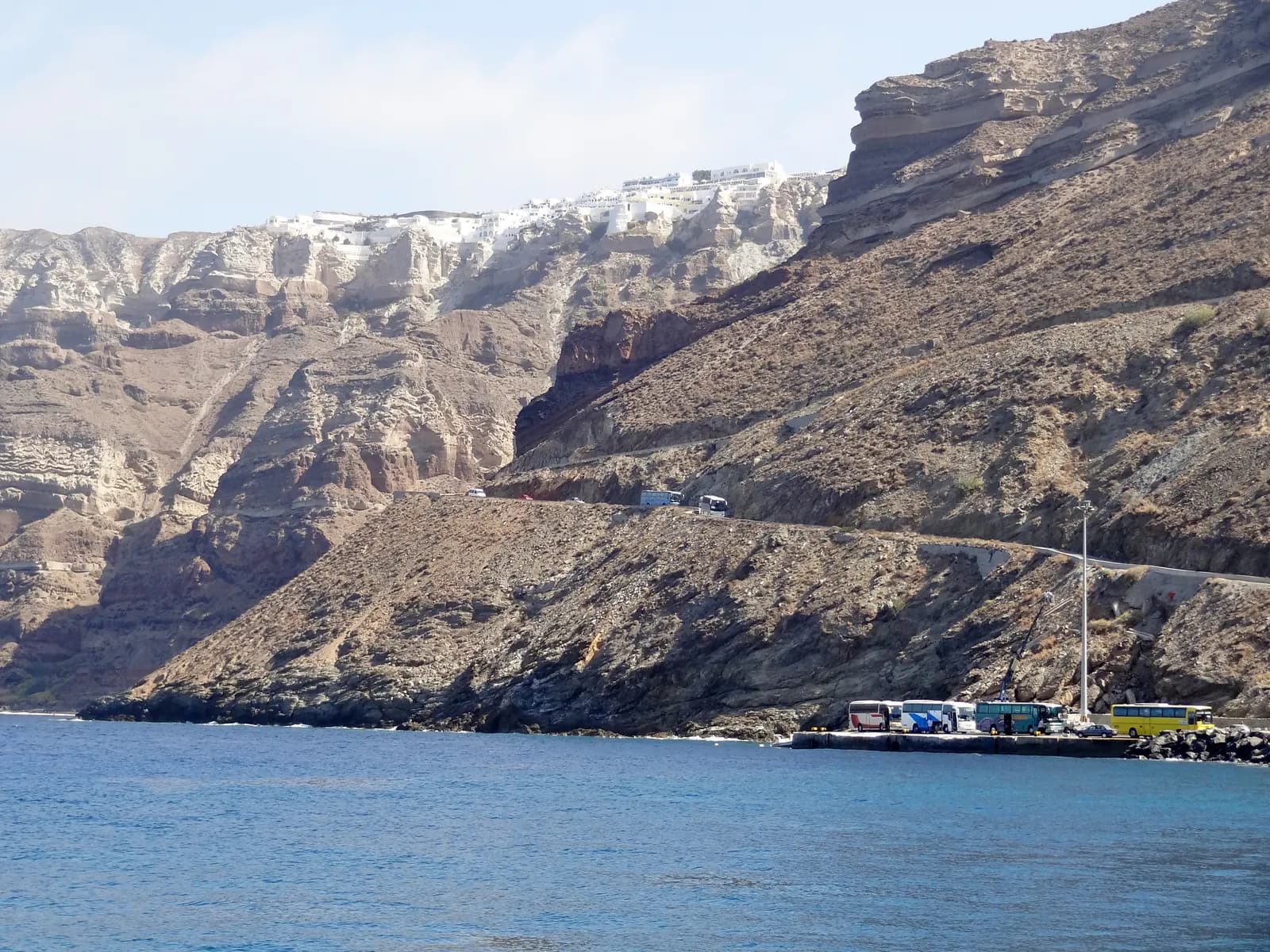 The switchback road climbing the caldera cliff from Athinios port on Santorini