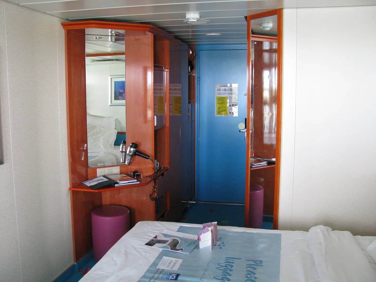 A balcony cabin on a cruise ship looking out over the sea