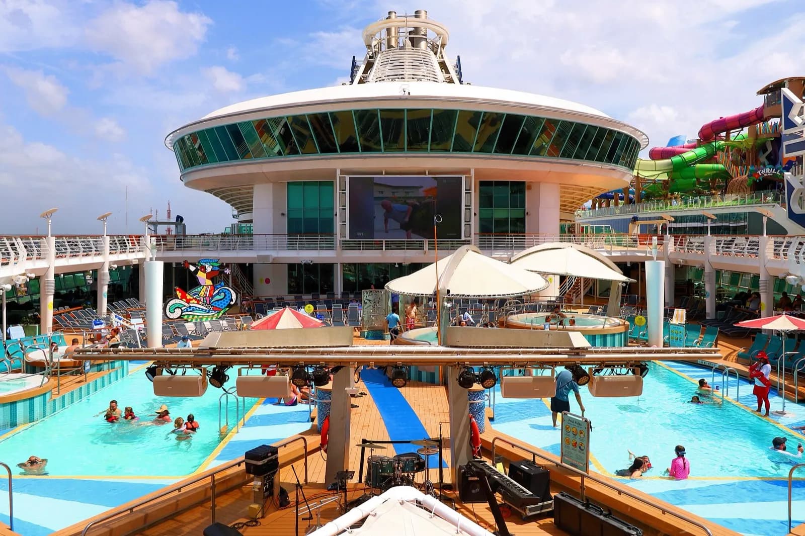 The pool deck of a large cruise ship on a sunny day
