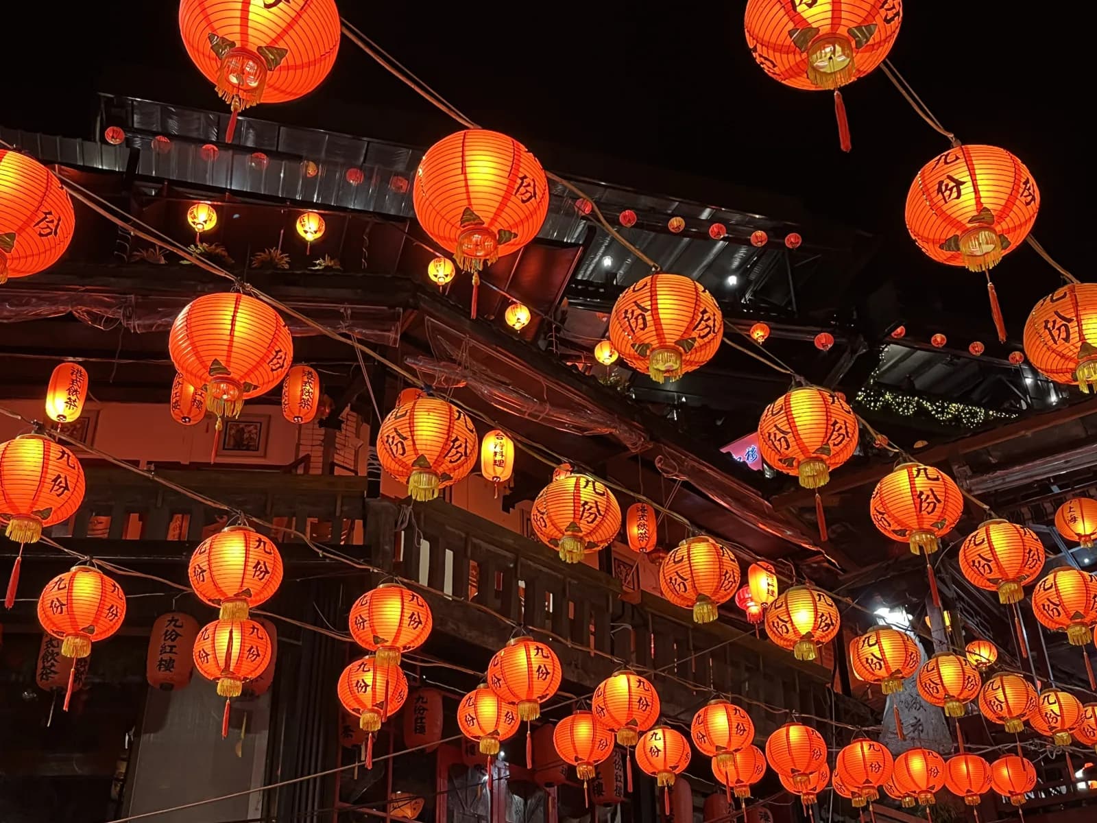 Red lanterns strung above the old street in Jiufen, the classic day trip from Taipei