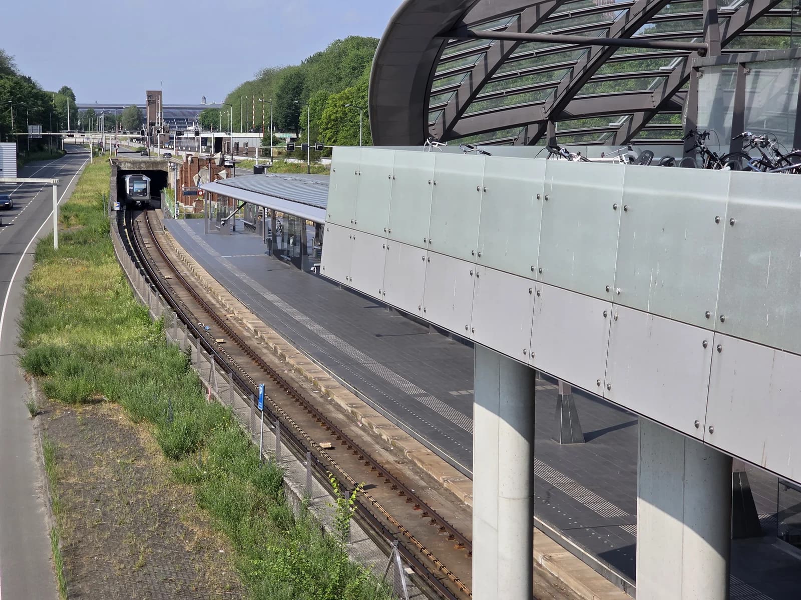 A metro train leaving the tunnel at Noorderpark station on the line through Amsterdam Noord