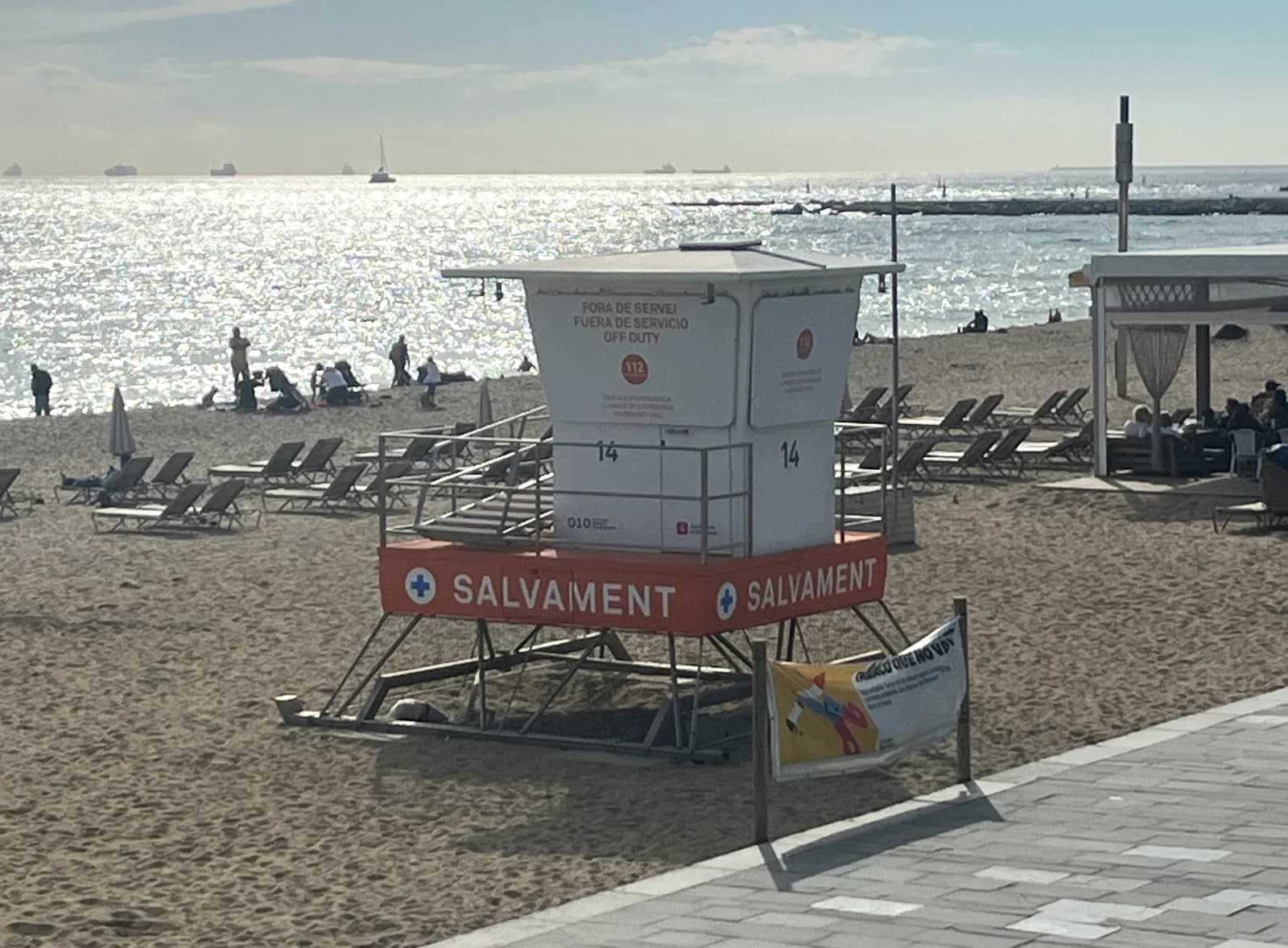 A lifeguard tower on the sand at Platja del Bogatell in Barcelona