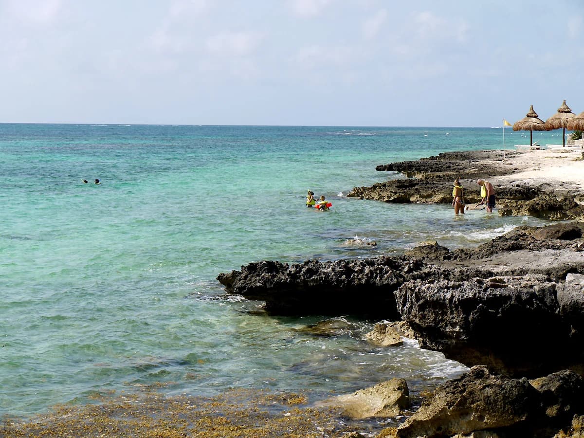 Rocky shore and shallow turquoise water at Punta Nizuc, the southern tip of Cancun's Hotel Zone