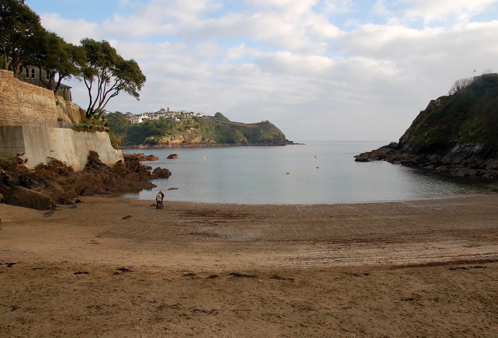 The small sandy beach at Readymoney Cove in Fowey, looking out to the mouth of the estuary