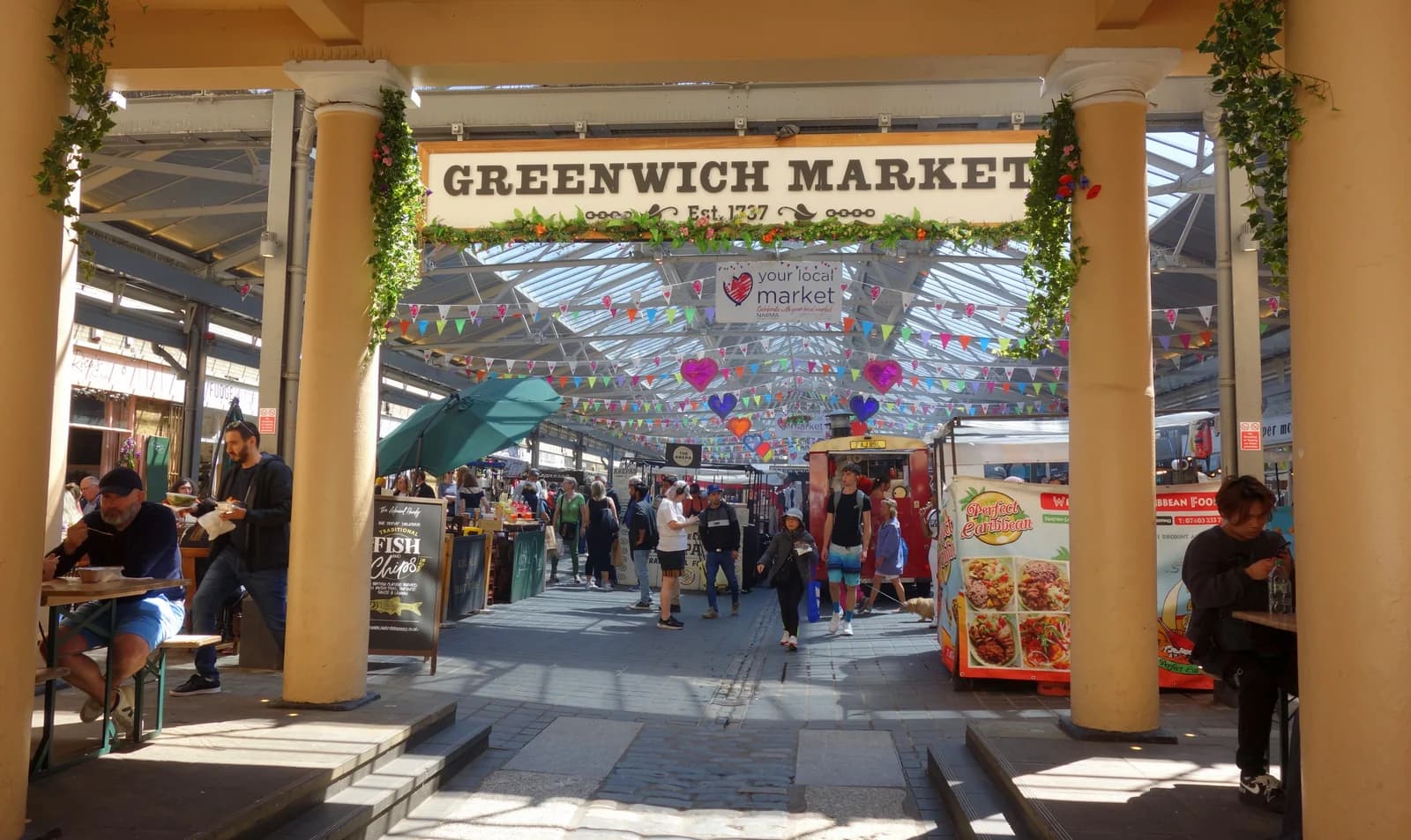 The entrance arch and bunting of Greenwich Market in south-east London