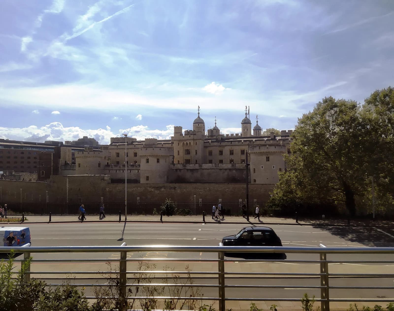 The outer walls of the Tower of London seen from Tower Hill across the road