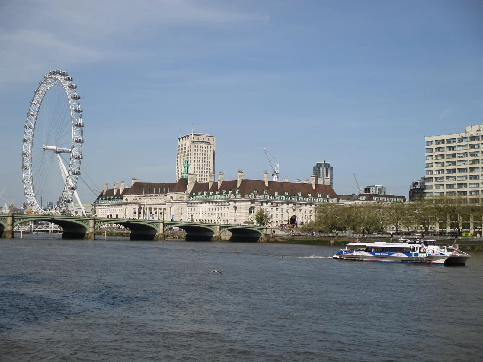 Westminster Bridge and the London Eye seen across the Thames, with County Hall on the South Bank