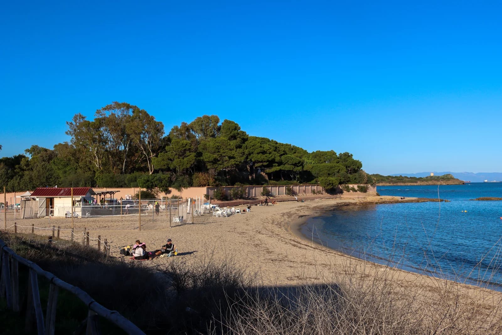A sandy beach beside the ancient site of Nora on the Pula coast