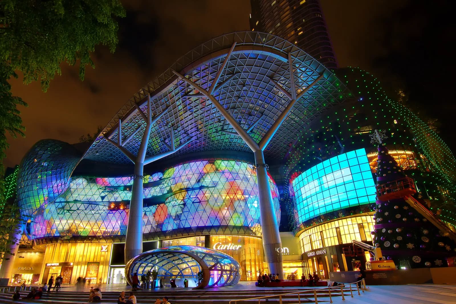The lit facade of the ION Orchard mall on Orchard Road at night