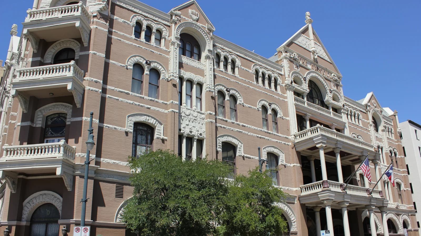 The 1886 brick and limestone frontage of The Driskill on Sixth Street in downtown Austin