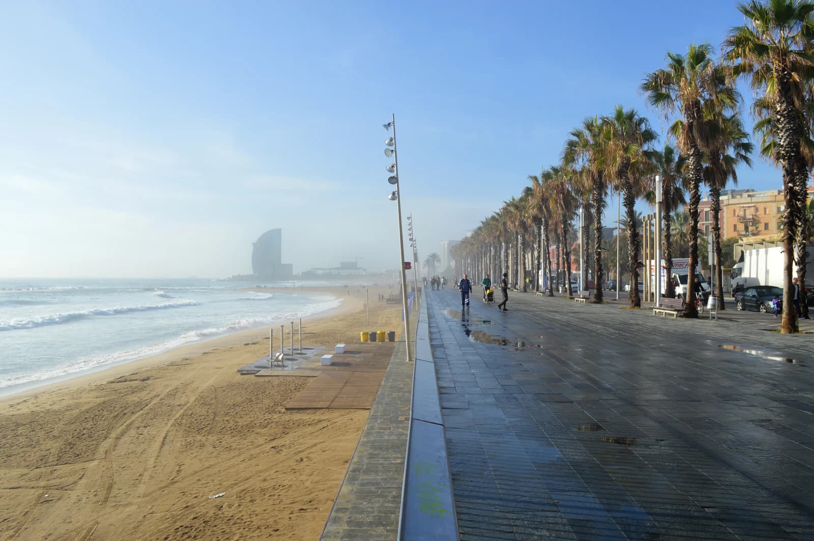 The promenade and sand of Platja de la Barceloneta on the Barcelona seafront