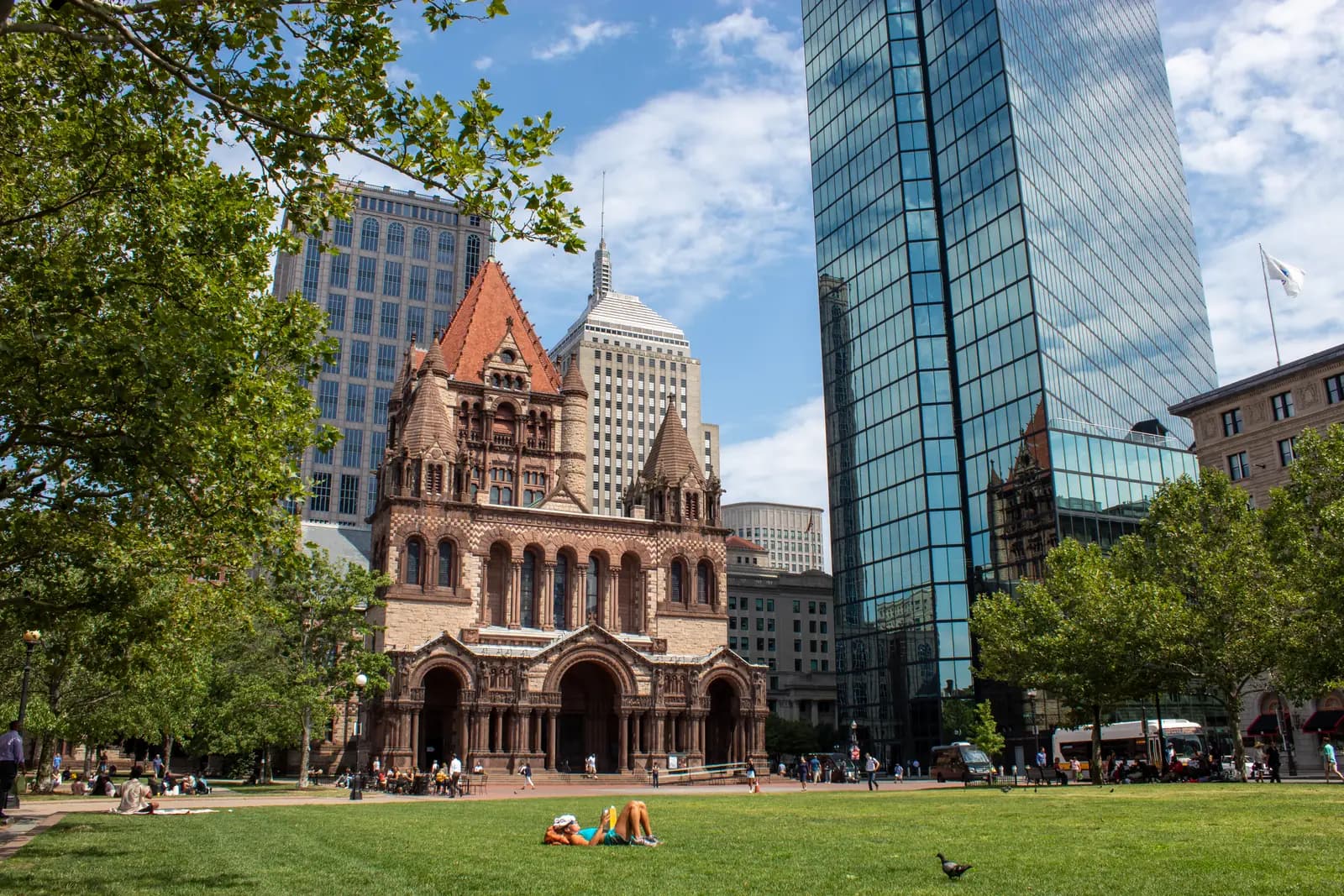 Trinity Church and the Hancock Tower across the lawn at Copley Square in Boston's Back Bay