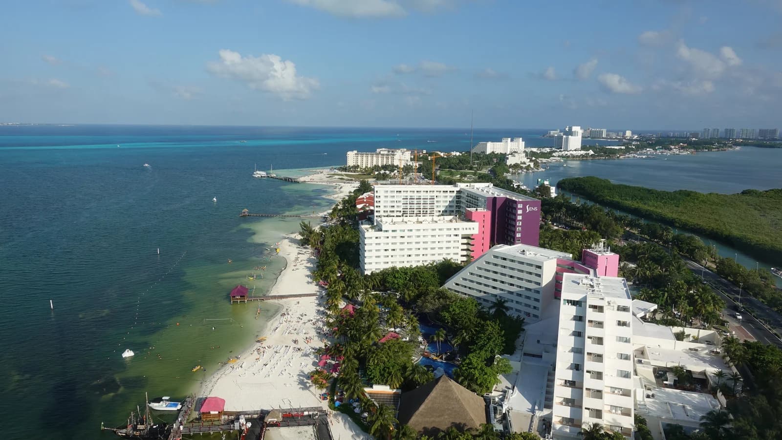 Cancun's Hotel Zone from above, with the beach on one side and the Nichupte Lagoon behind