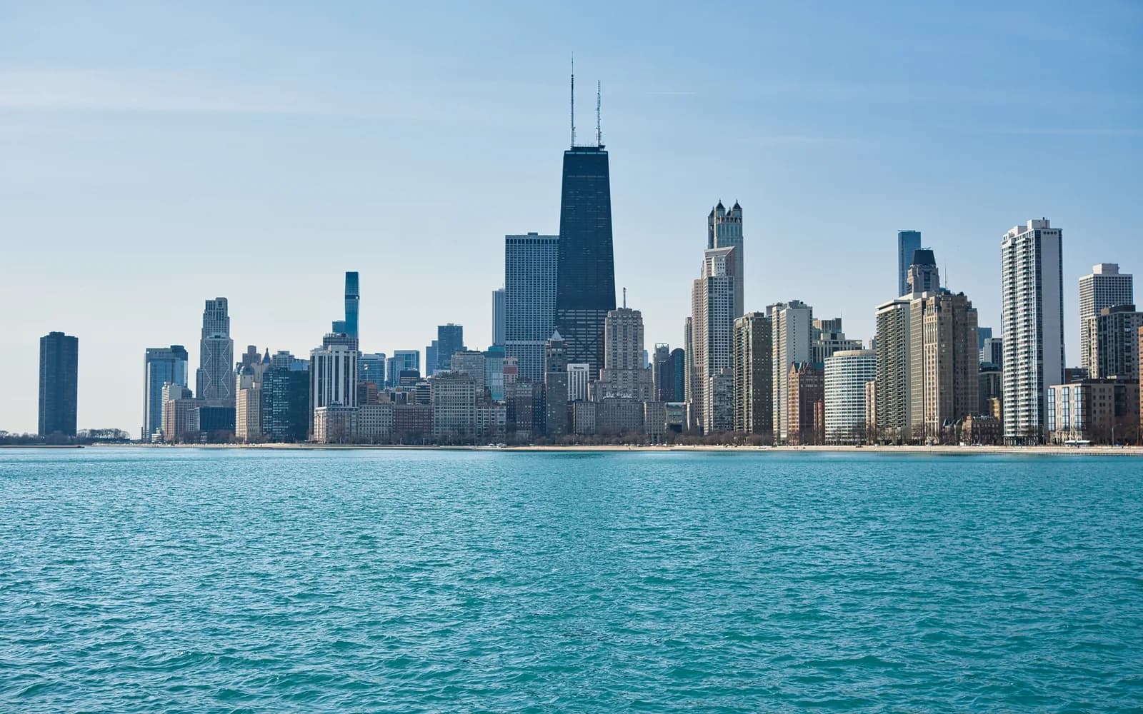 The Chicago lakefront skyline seen across Lake Michigan from the North Avenue Beach pier on a clear day
