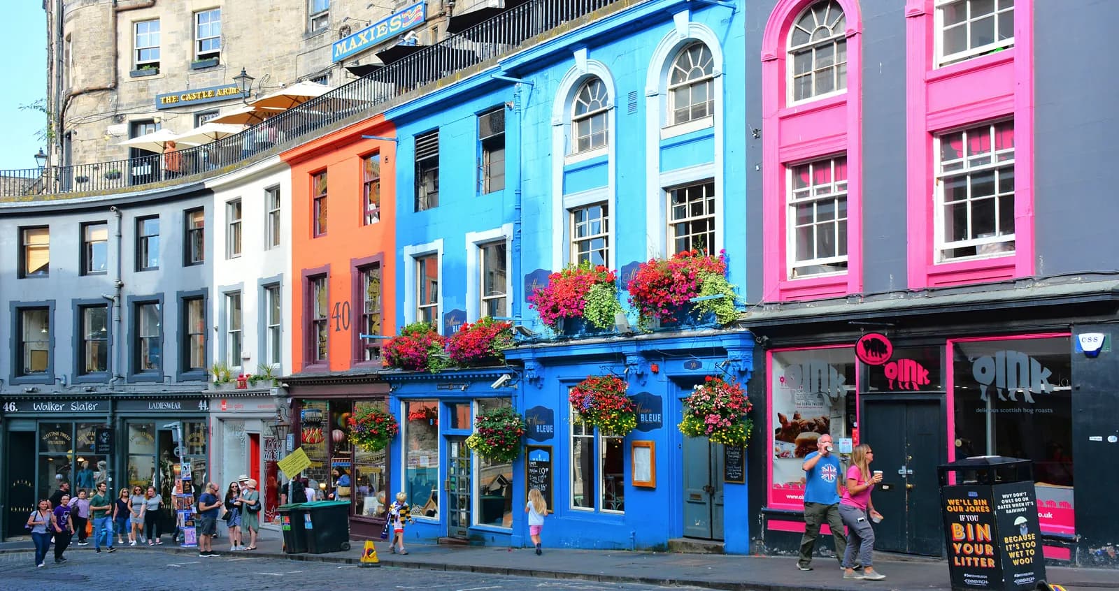 The painted shopfronts of Victoria Street curving up towards the Grassmarket in Edinburgh's Old Town