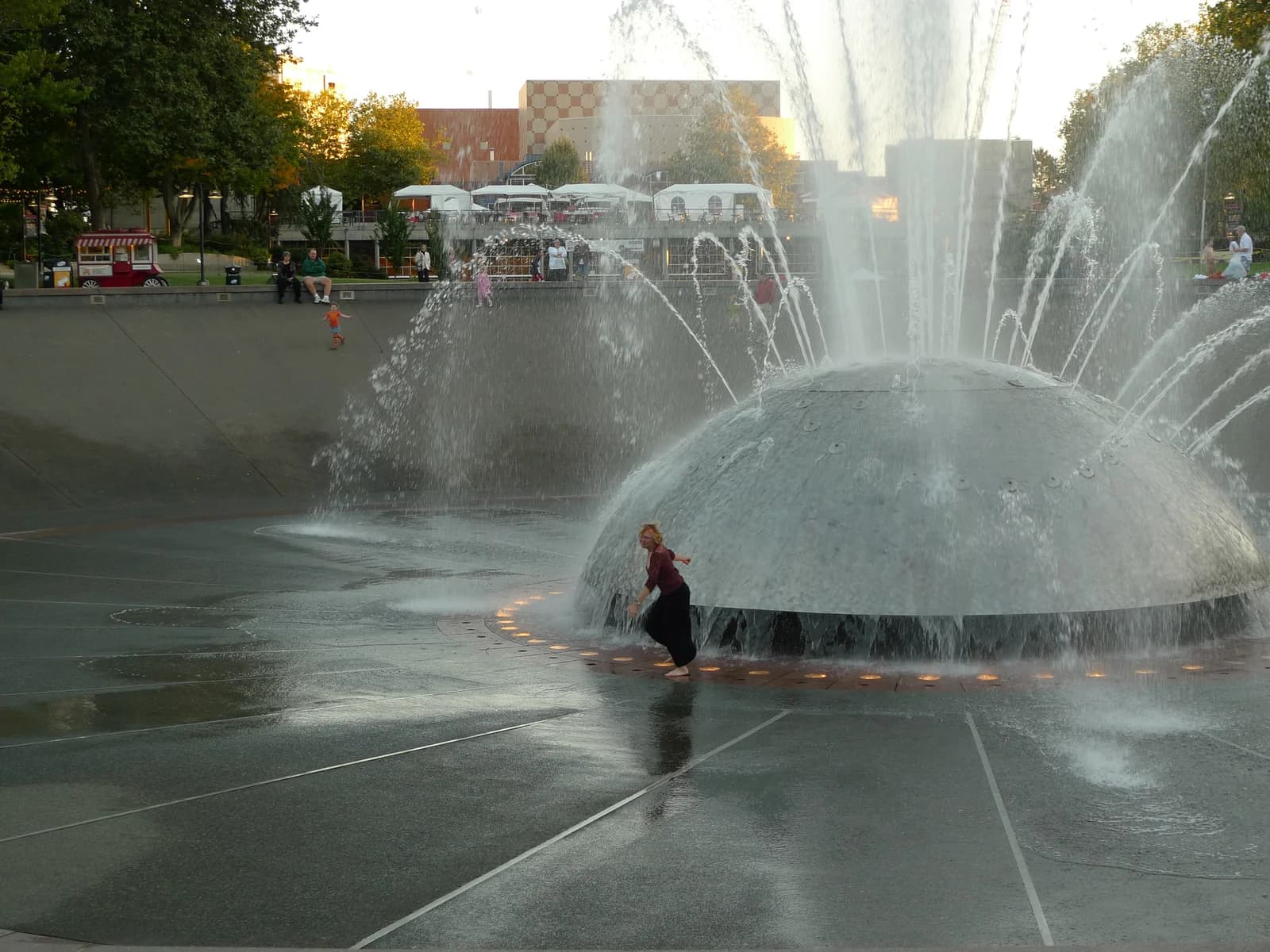Children playing in the spray of the International Fountain at Seattle Center