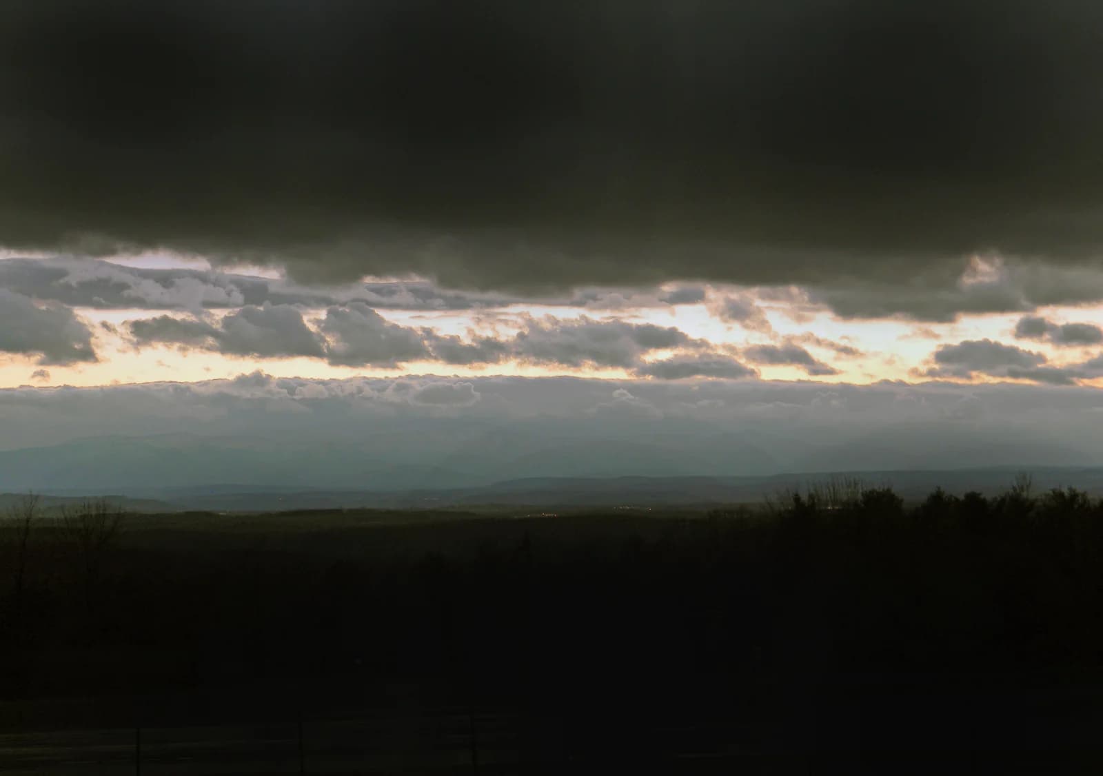 Mist clearing over wooded hills in the Catskills after rain