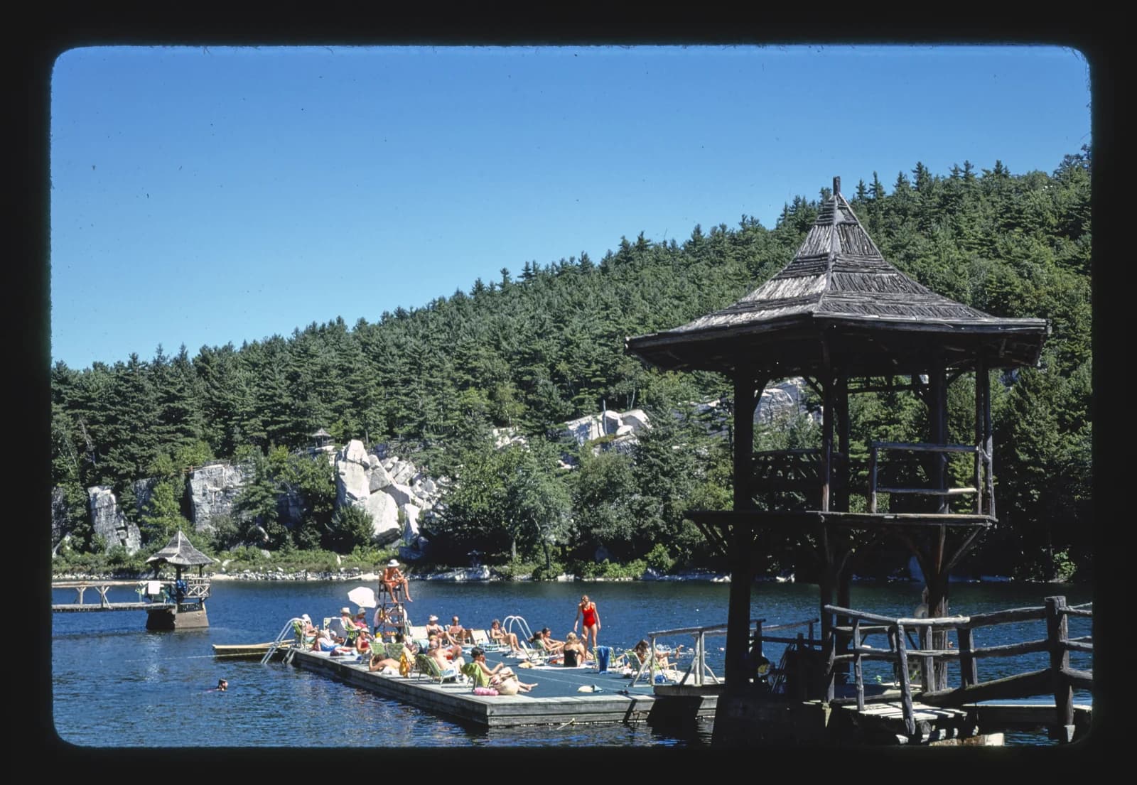 The swimming beach and dock on Mohonk Lake at New Paltz, New York
