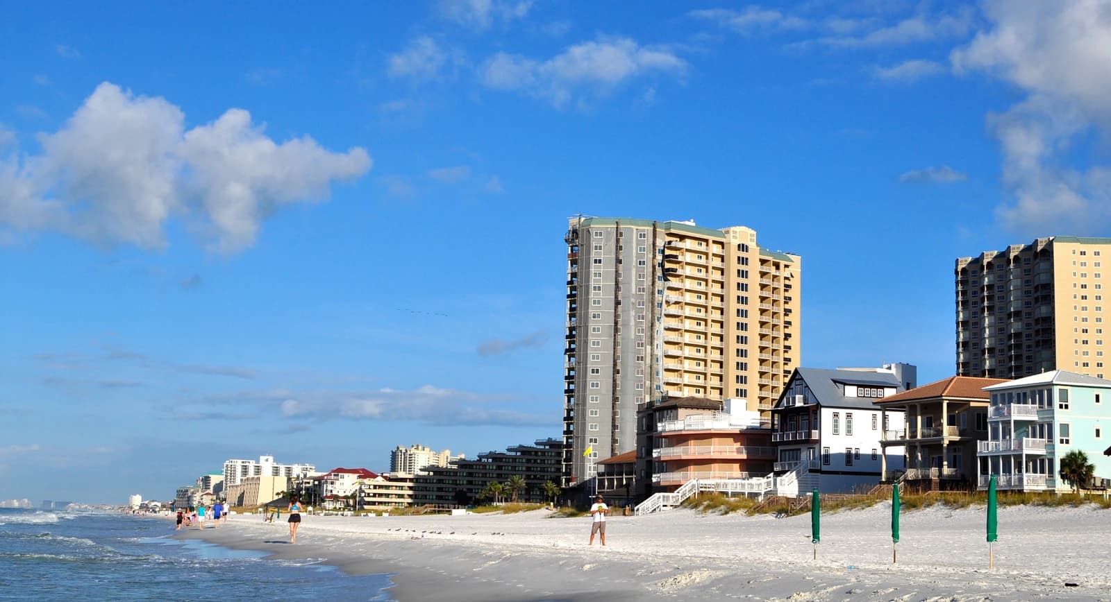 Condominium towers and beach houses above the white sand at Miramar Beach on the Destin strip in Florida