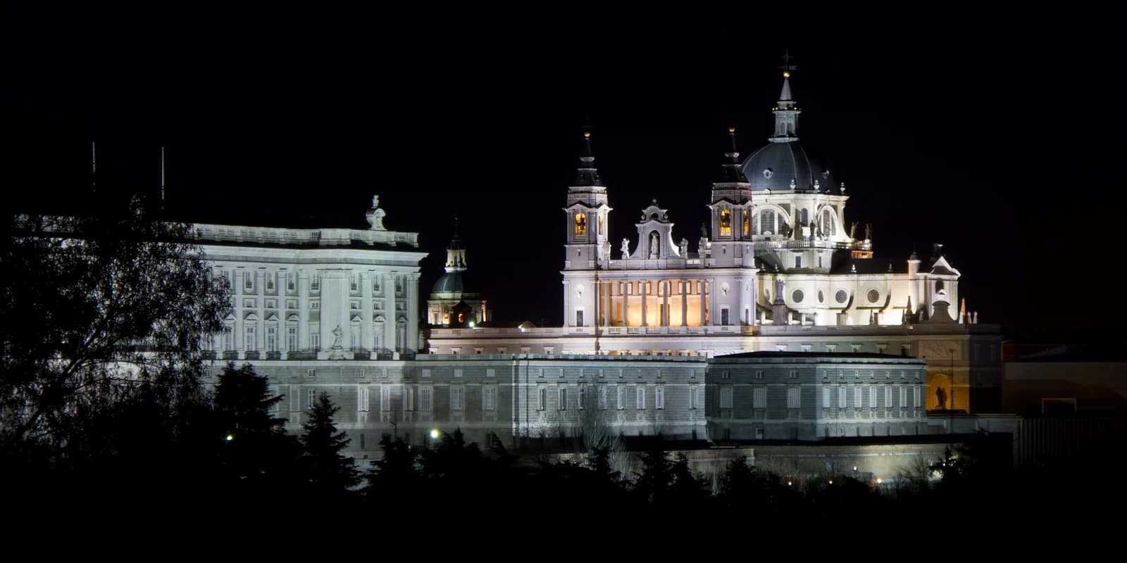 The Royal Palace and the Almudena cathedral lit at night in Madrid