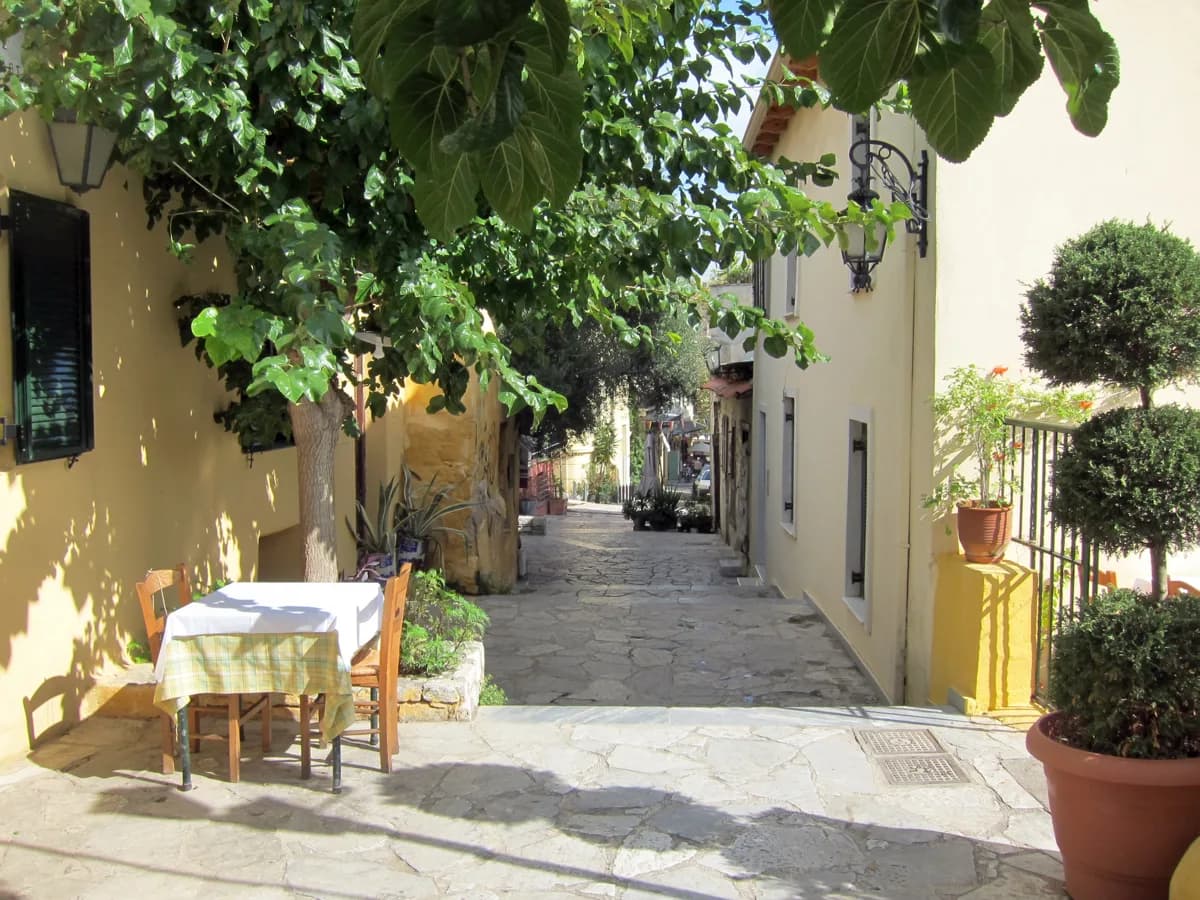 A vine-shaded taverna lane in Plaka, the central Athens alternative to sleeping at the port