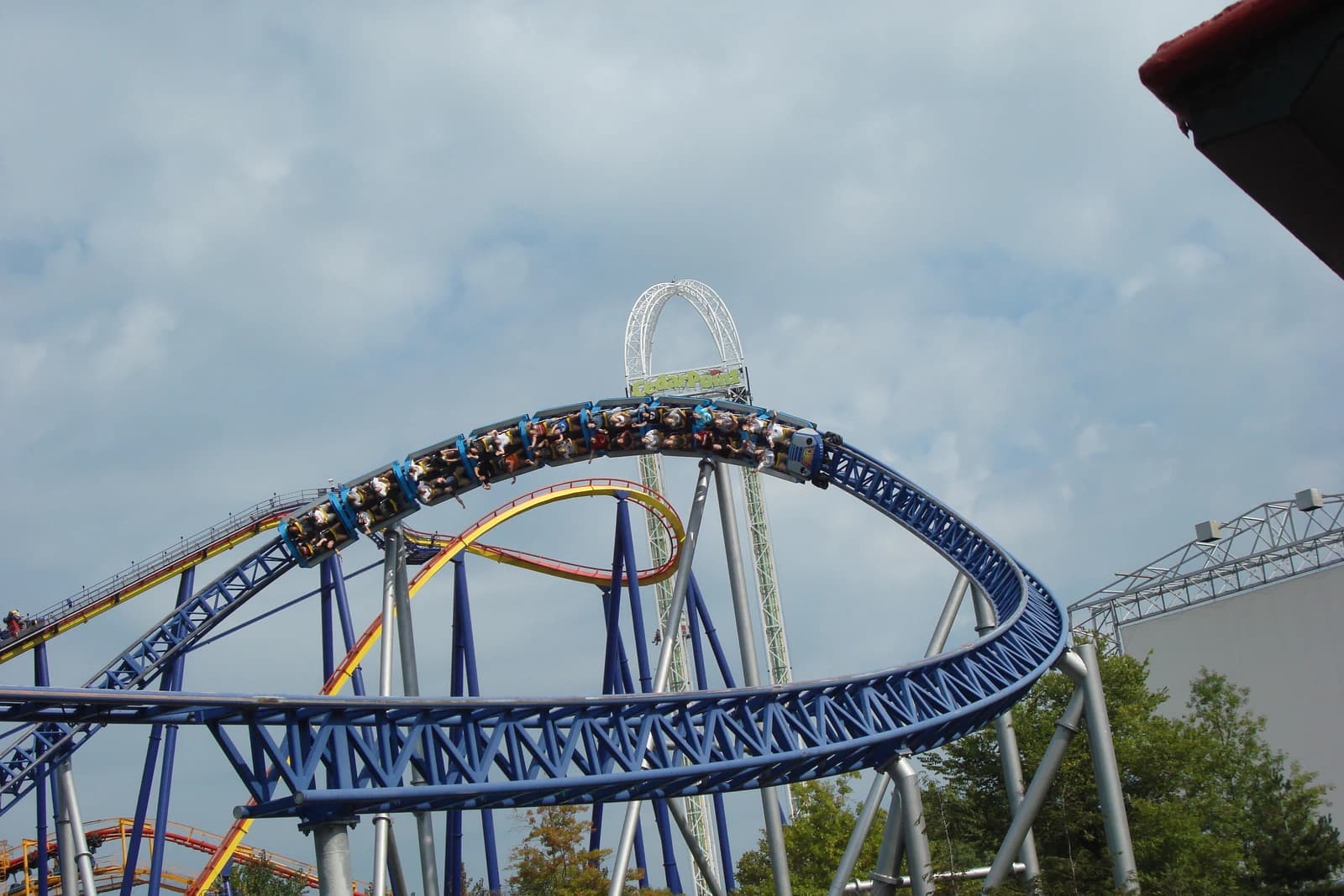 A roller coaster train cresting the track against the sky at Cedar Point in Sandusky, Ohio