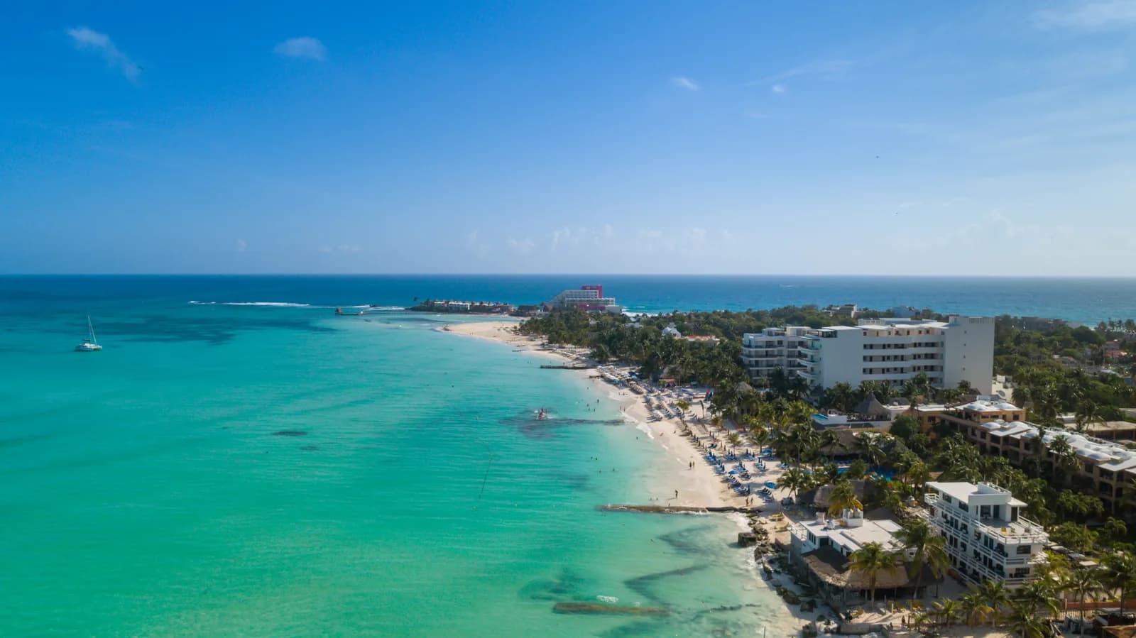 Aerial view of Playa Norte on Isla Mujeres near Cancun, with turquoise Caribbean water, white sand and palm trees