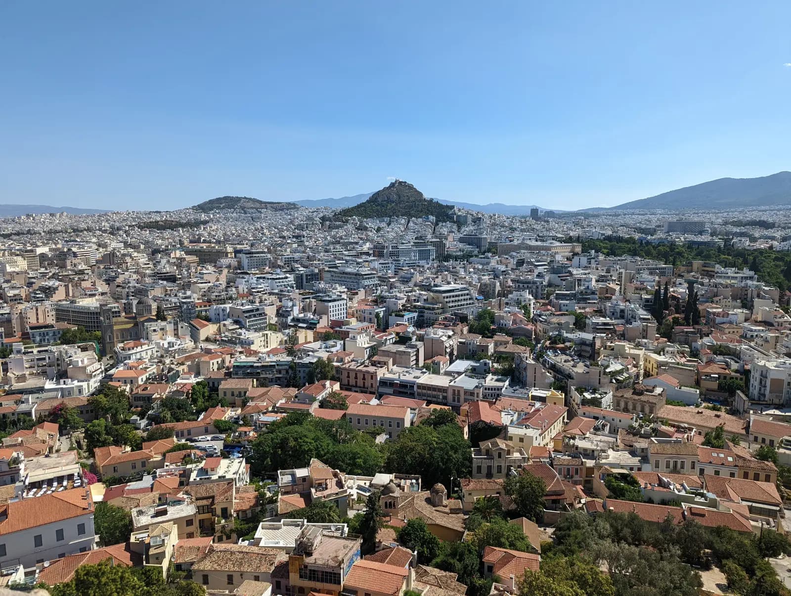The rooftops of central Athens seen from the Acropolis, with Lycabettus Hill beyond