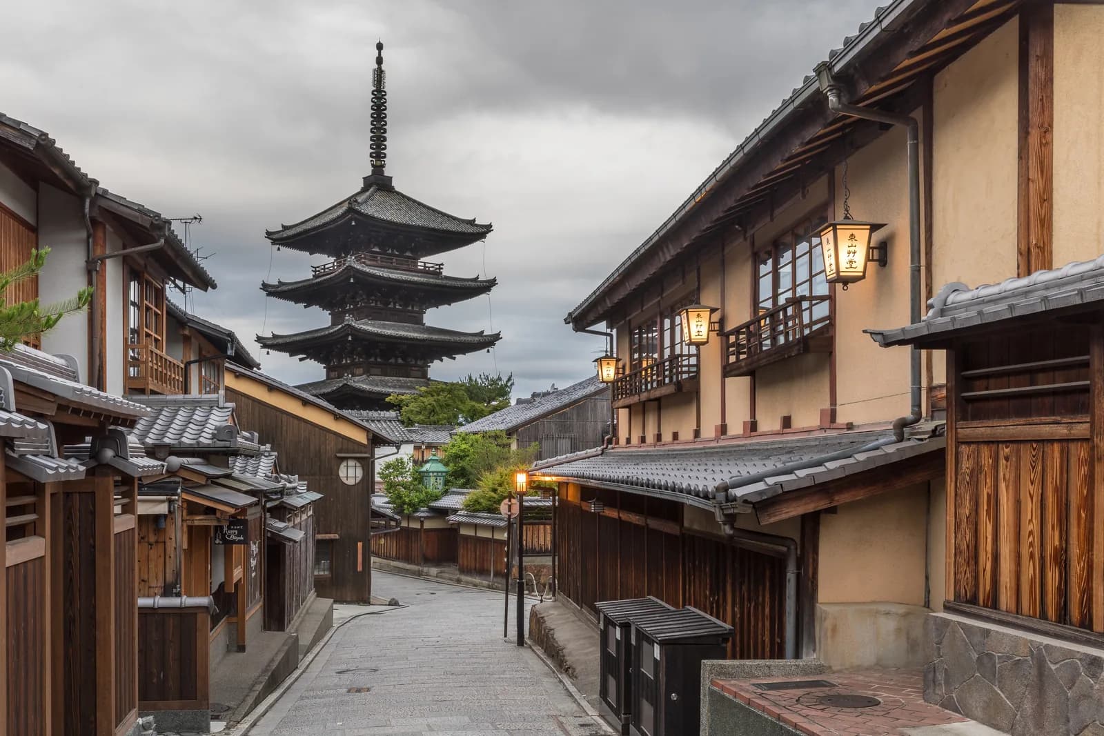 The Yasaka pagoda rising over a Higashiyama lane of traditional machiya houses at dawn