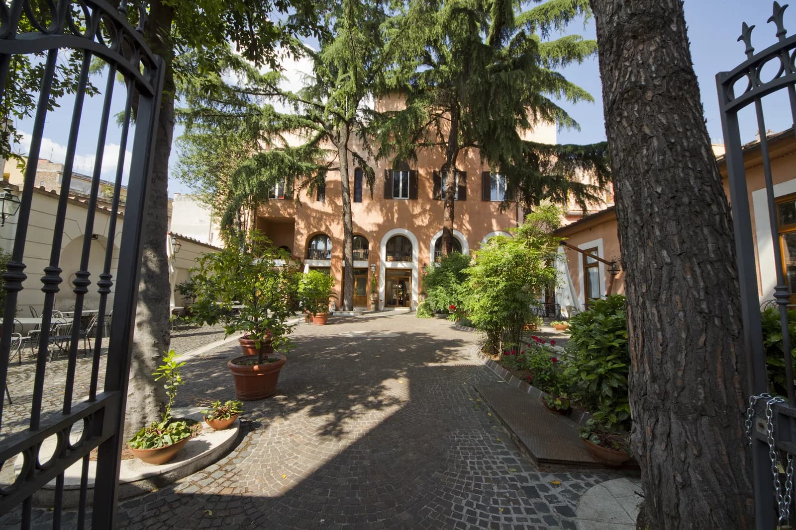A shaded courtyard in the Monti rione of Rome, the closest central area to the Colosseum for families