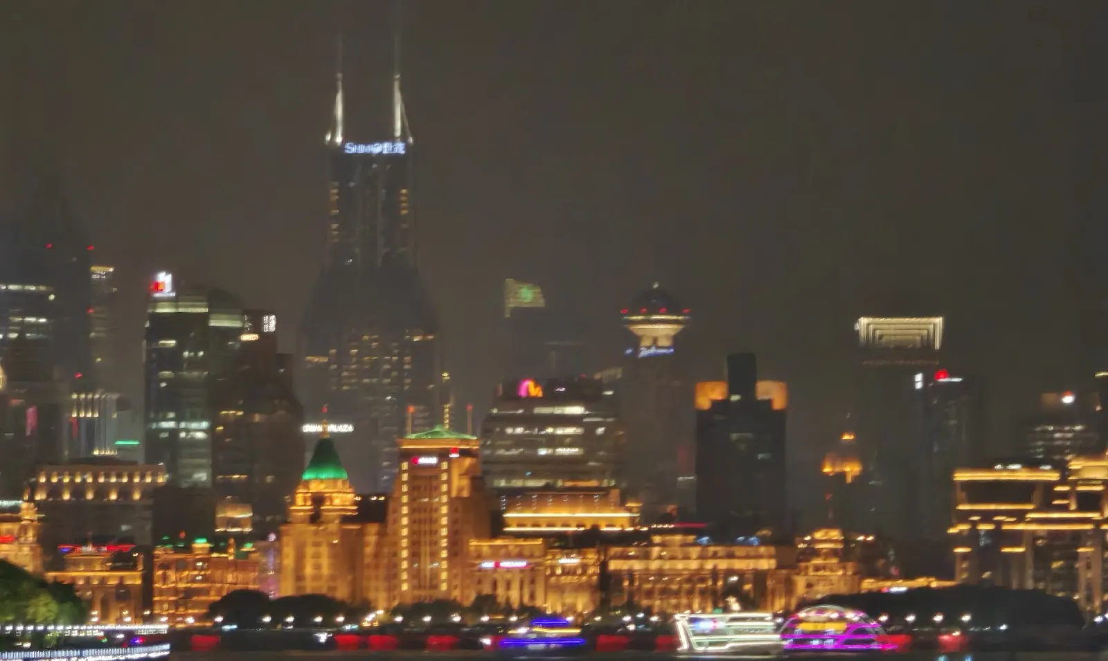 The Pudong skyline lit up at night seen from the Bund waterfront in Shanghai