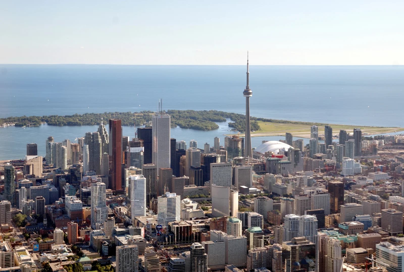 Downtown Toronto from above, with the islands and the CN Tower, showing how tightly the central neighbourhoods sit together