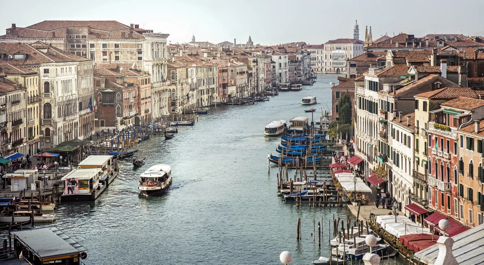 The Grand Canal in Venice seen from the Rialto bridge, with vaporetti and moored gondolas