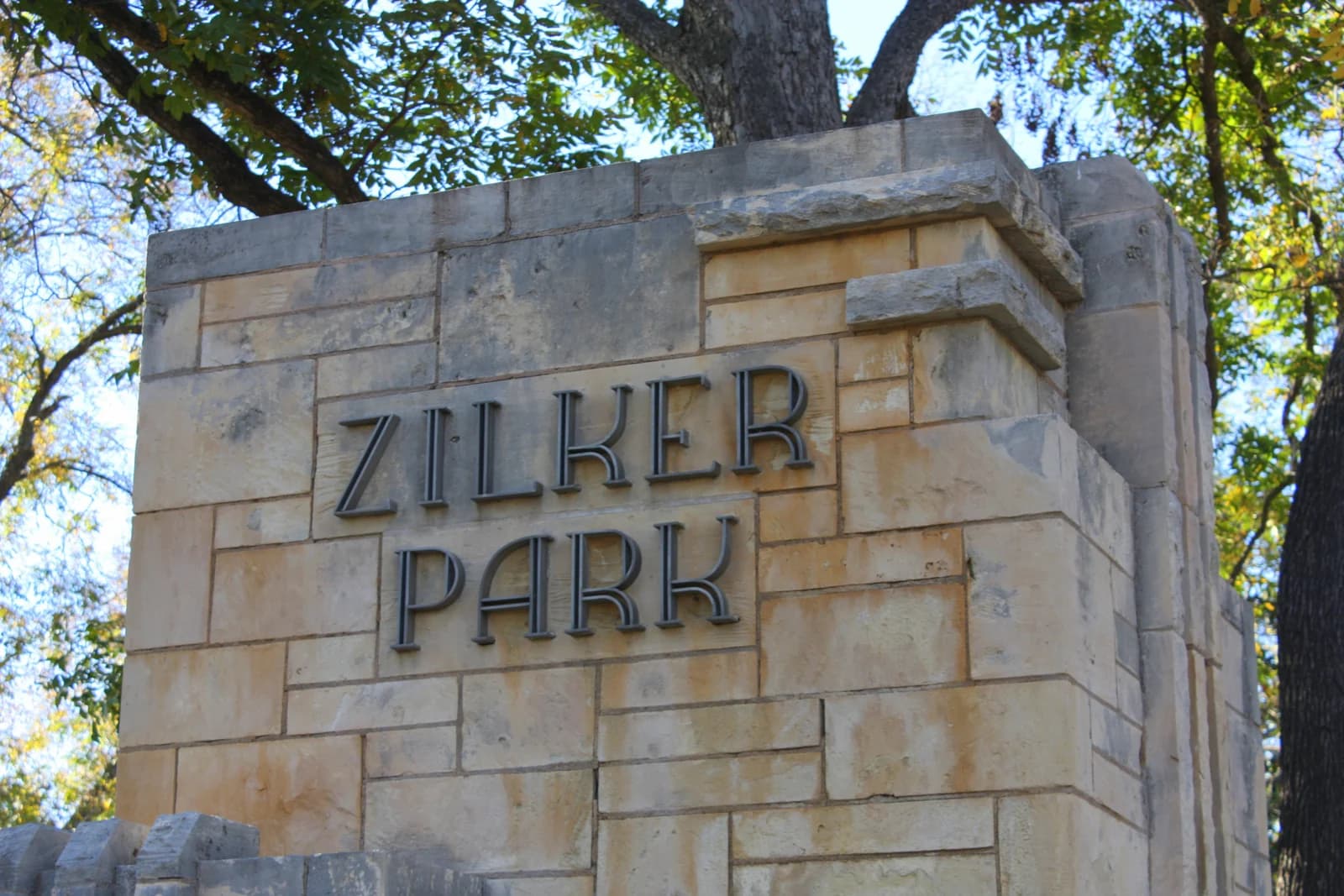 The carved stone entrance marker at Zilker Metropolitan Park in Austin