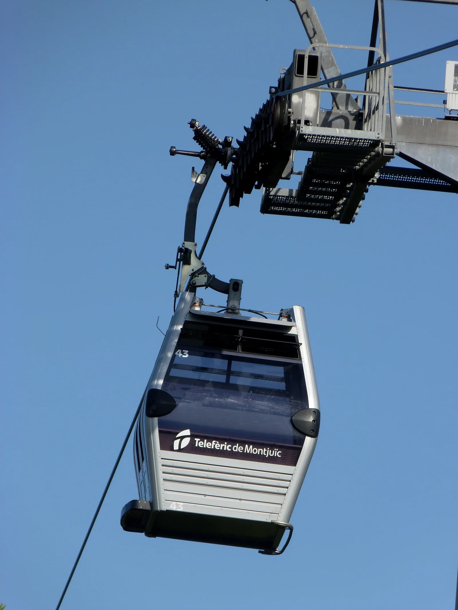 A gondola of the Montjuic cable car climbing towards the castle