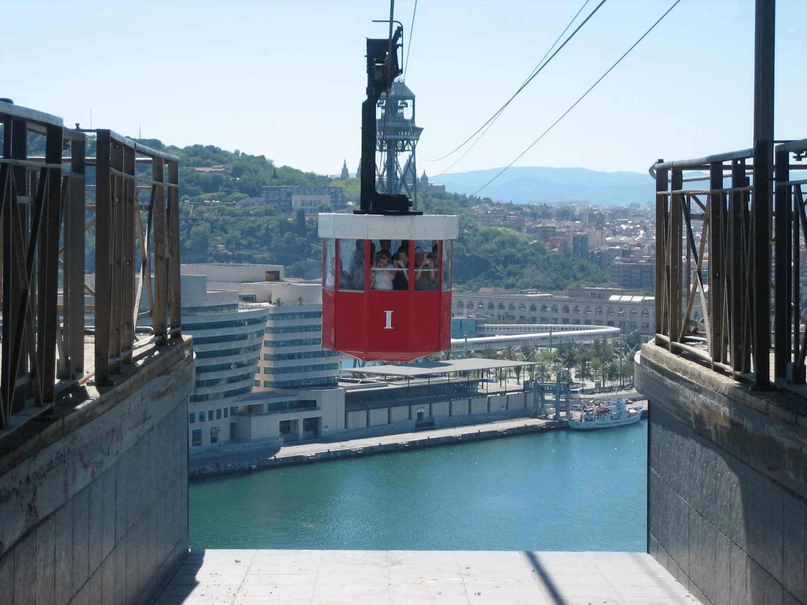 A cabin of the Port Vell aerial tramway crossing above Barcelona harbour
