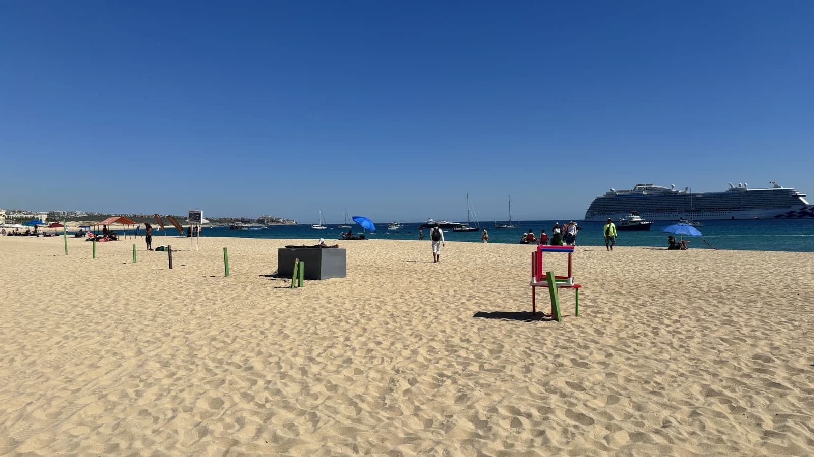 The sand and calm bay at Playa El Medano, the town beach in Cabo San Lucas