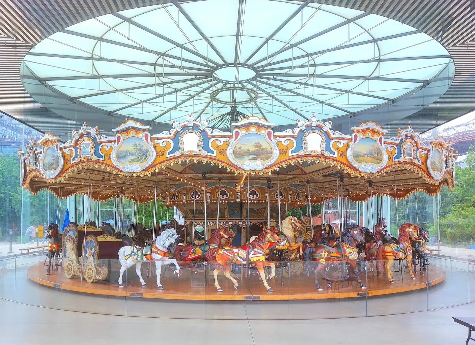 Jane's Carousel in its glass pavilion on the Brooklyn waterfront at DUMBO