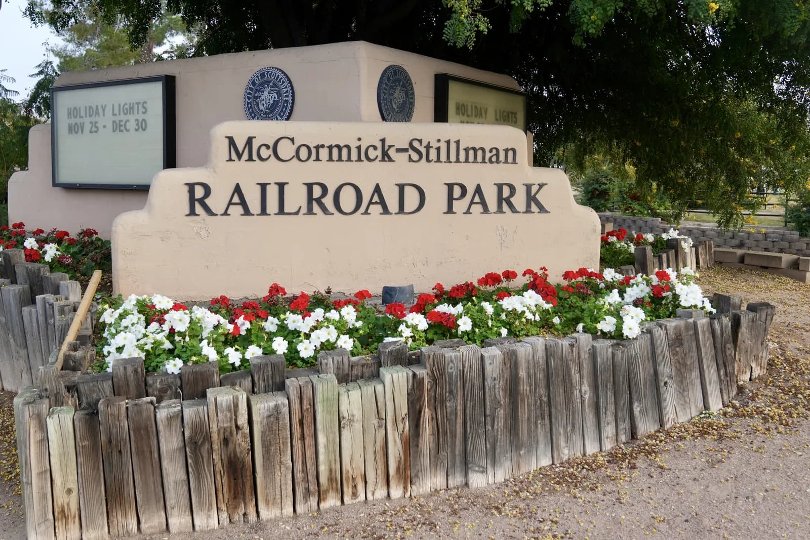 The entrance sign and flower beds at McCormick-Stillman Railroad Park in Scottsdale
