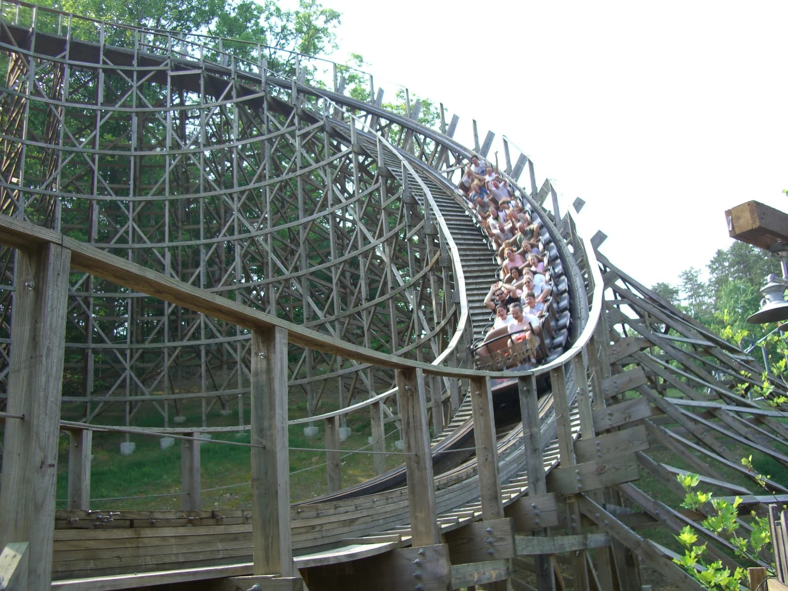 A train cresting the wooden Thunderhead roller coaster at Dollywood in Pigeon Forge