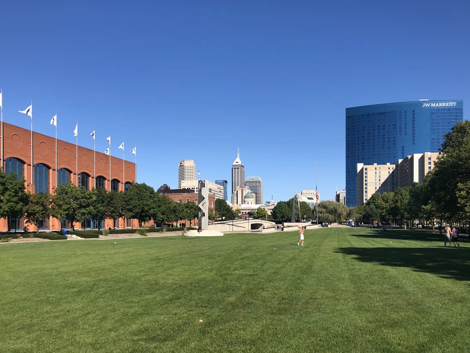 The open lawn at White River State Park with the downtown Indianapolis skyline behind it