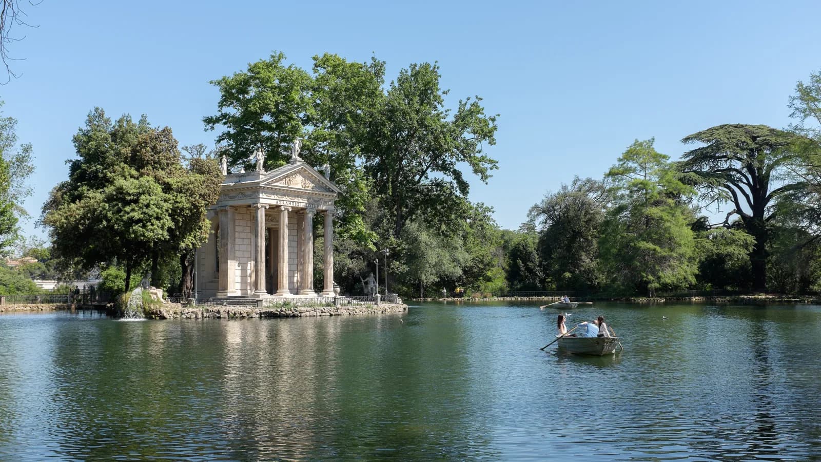 A rowing boat on the lake at Villa Borghese in Rome, the free half of most things to do in Rome with kids